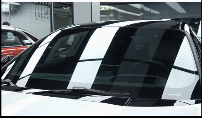 Premium ceramic window tinting on a car windshield for heat rejection and UV protection.