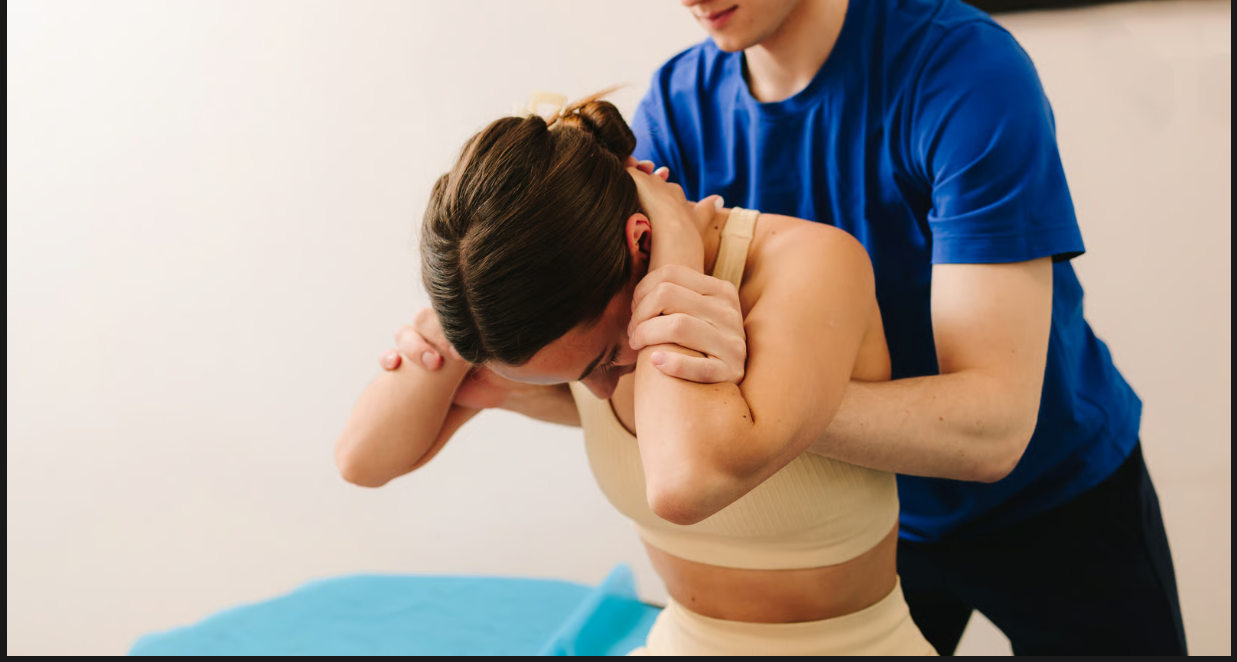 Patient receiving professional chiropractic services for neck and upper back pain relief.