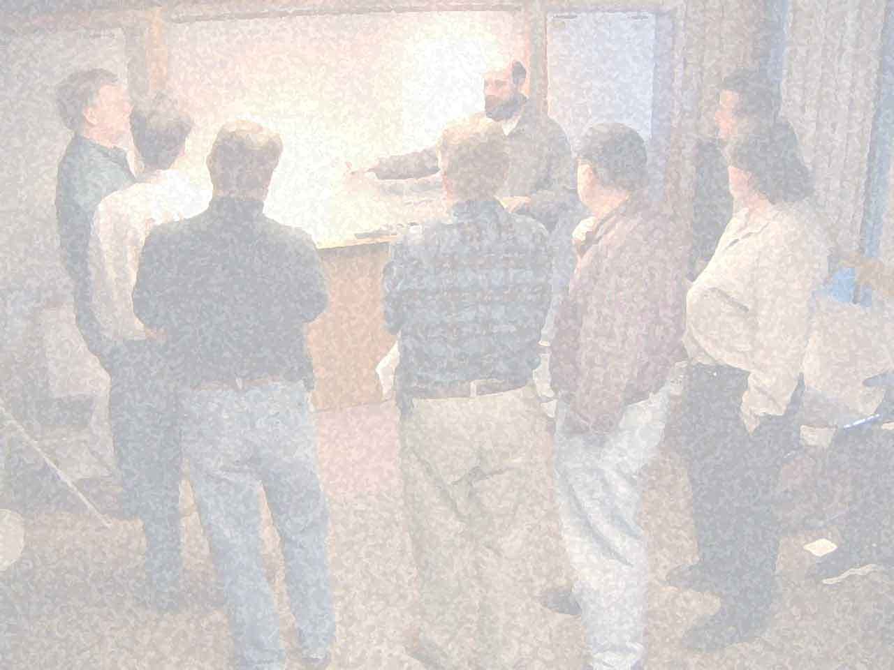 The group of engineers that wrote the Agile Manifesto, deliberating around a whiteboard in Snowbird, Utah