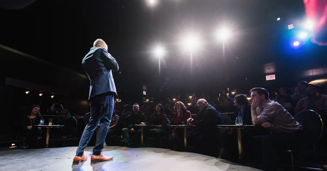 Magician on stage performing