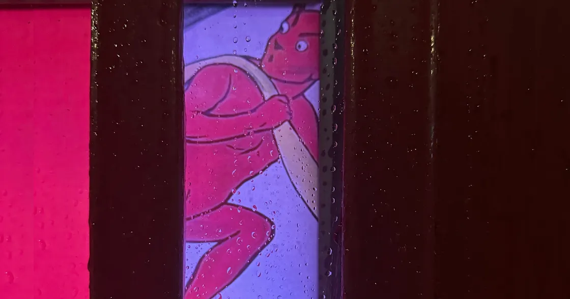 Harry Marvello on a Telephone Box