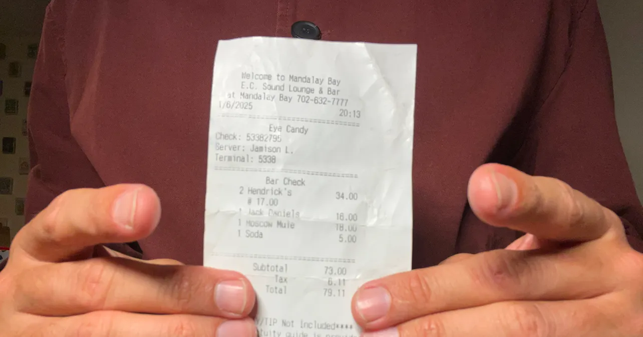 Hands holding a receipt
