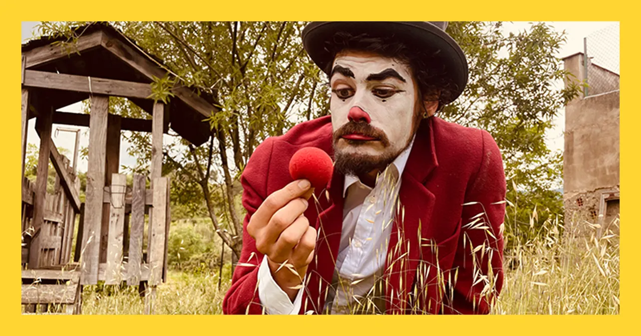 Clown holding red ball