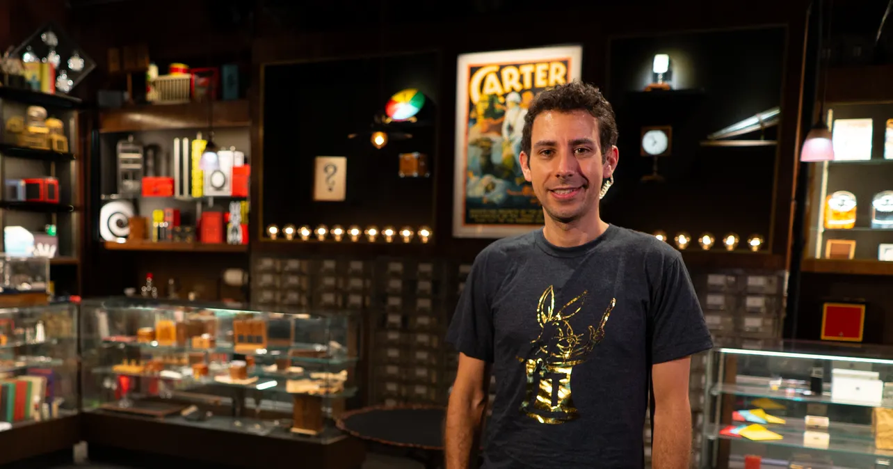 Adam Blumenthal standing in Tannen's Magic