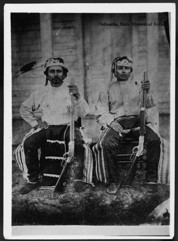 A portrait of Baptiste Bayhylle and Andrew Murray, Pawnee scouts, with their rifles. Both were scouts under Major North in 1868.