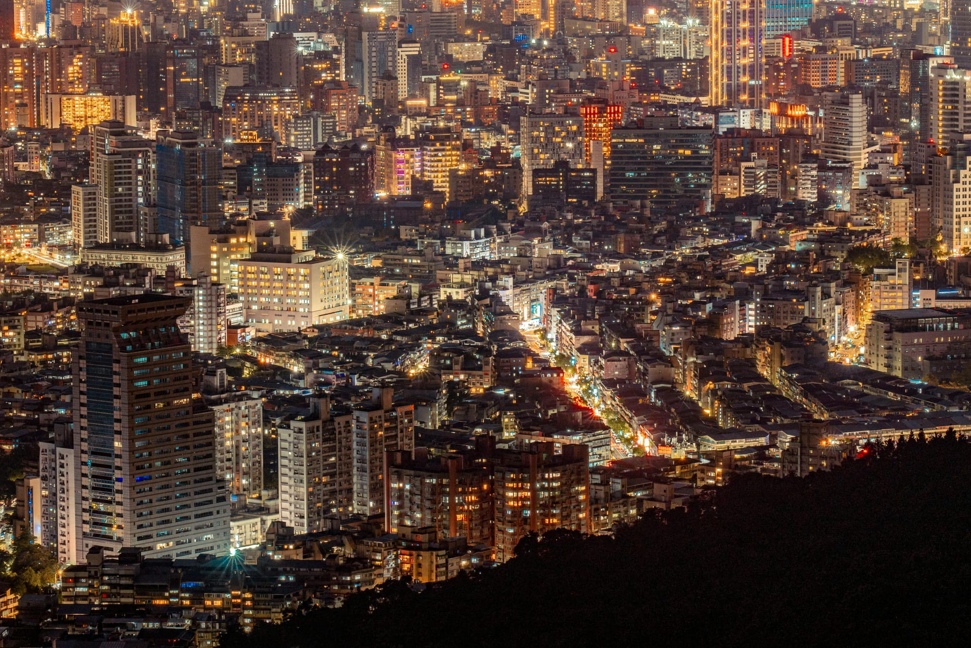 Photo of modern cityscape at night.