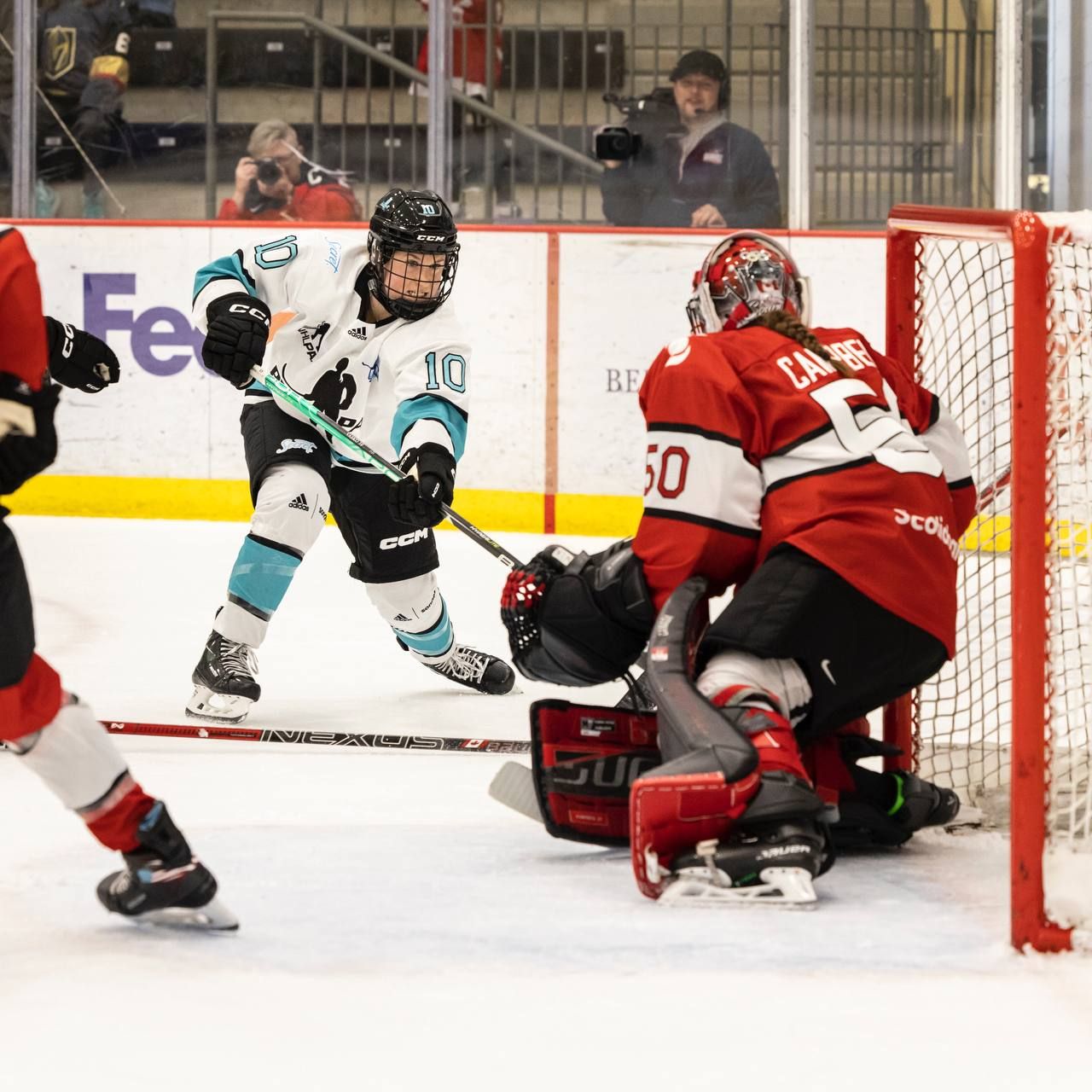 Goaltender Kristen Campbell squares up to a close-range shot by Alexa Vasko.
