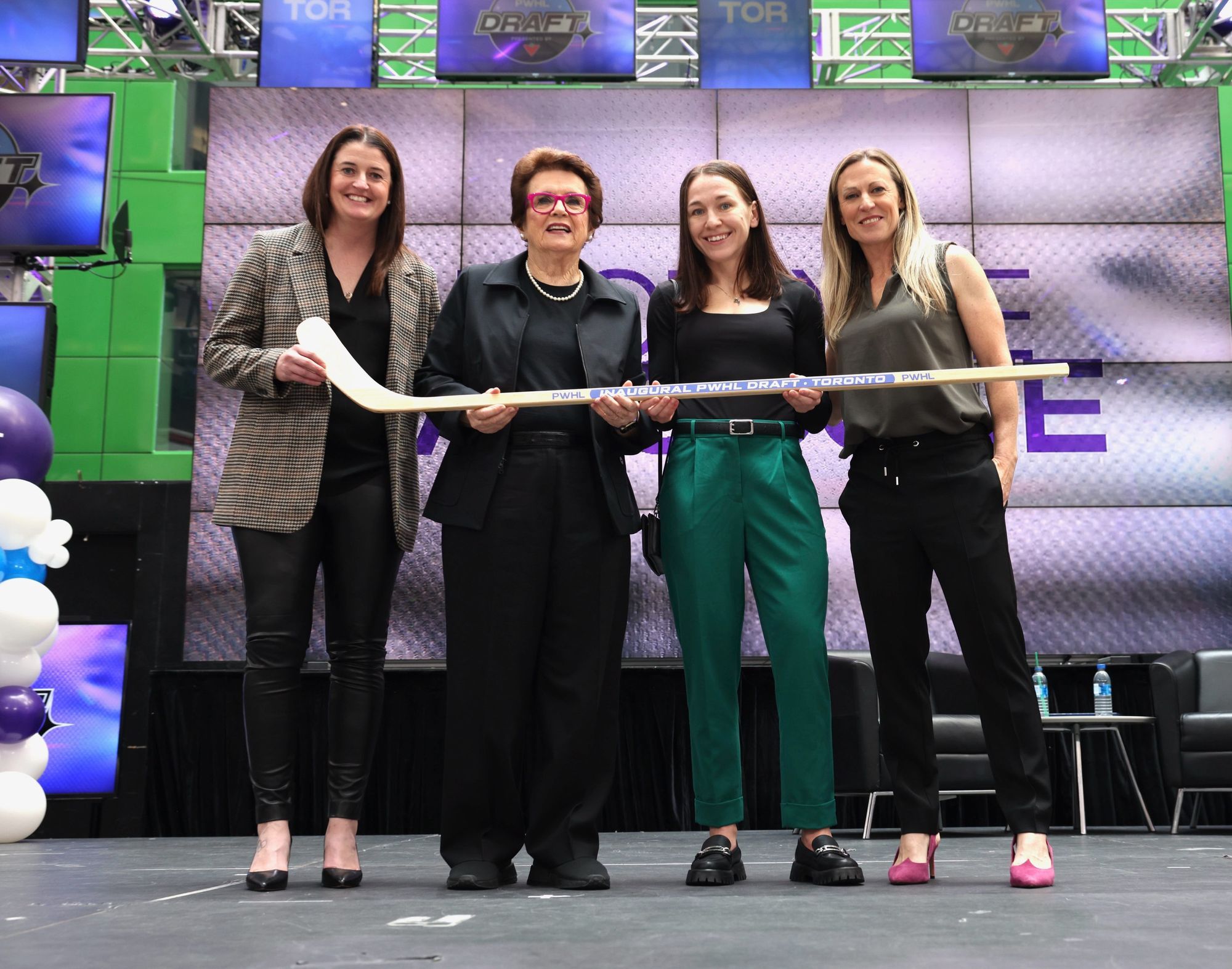 Gina Kingsbury, Billie Jean King, Jocelyne Larocque, and Jayna Hefford pose at the PWHL draft.