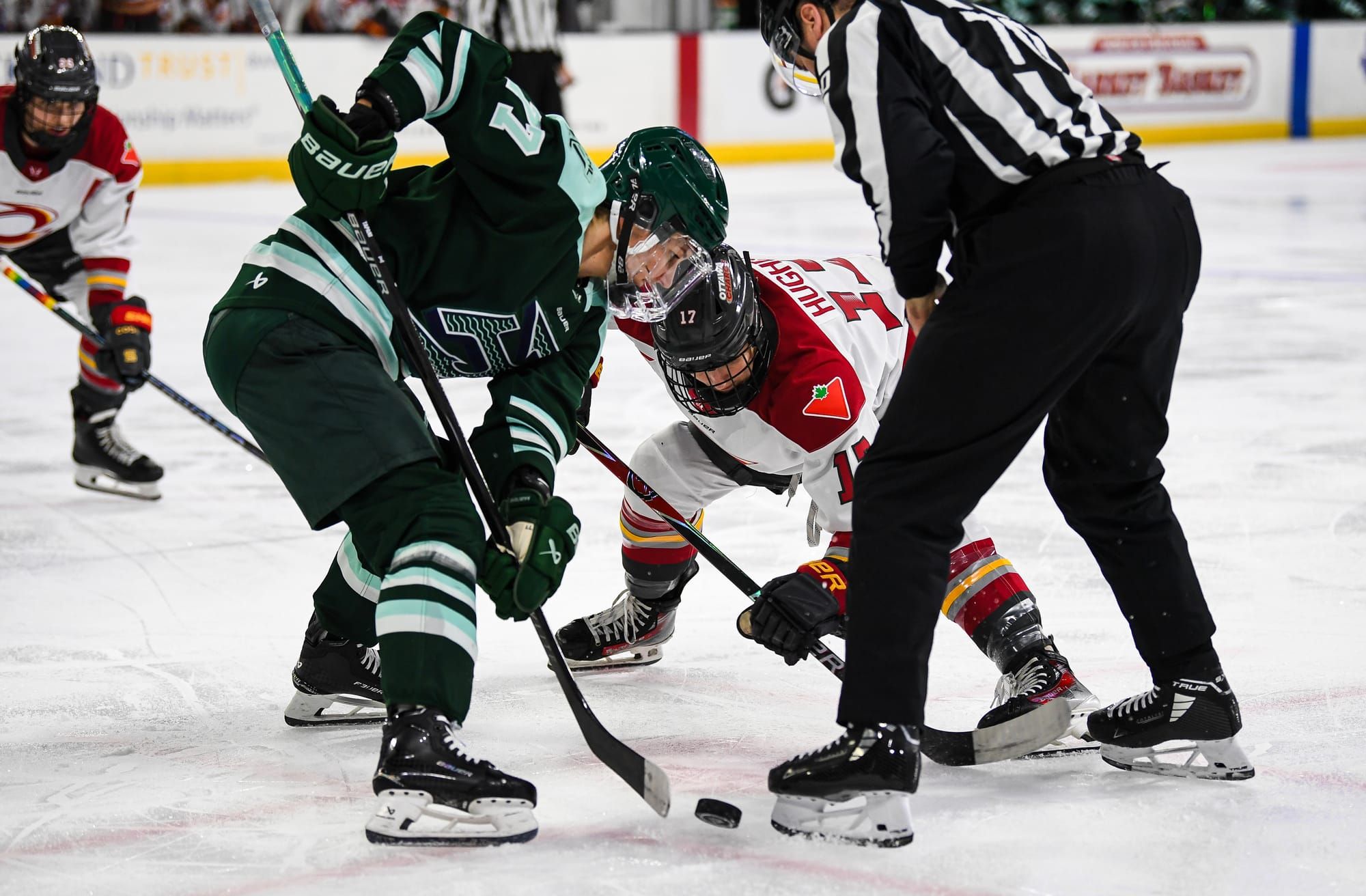 A Boston Fleet player takes a faceoff against Gabbie Hughes of the Ottawa Charge.