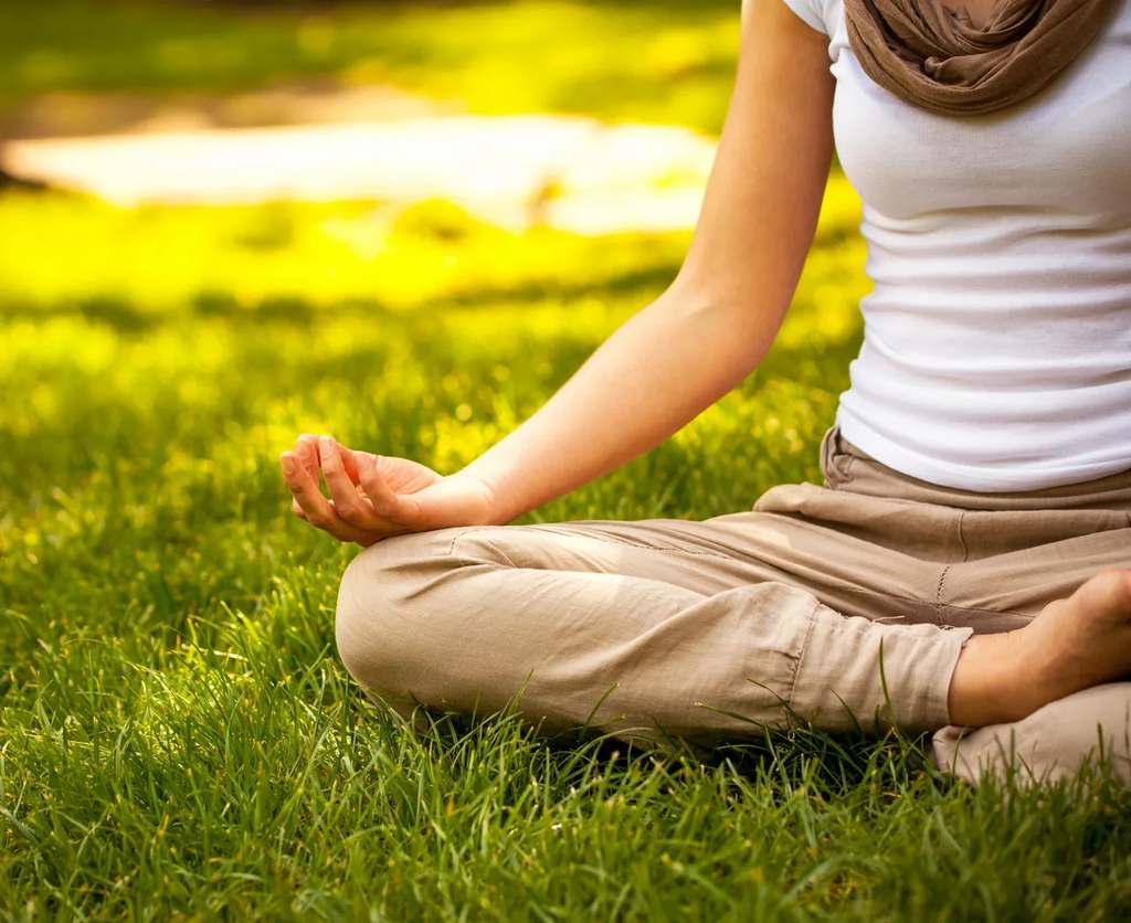 woman_meditating _on_the_grass.png