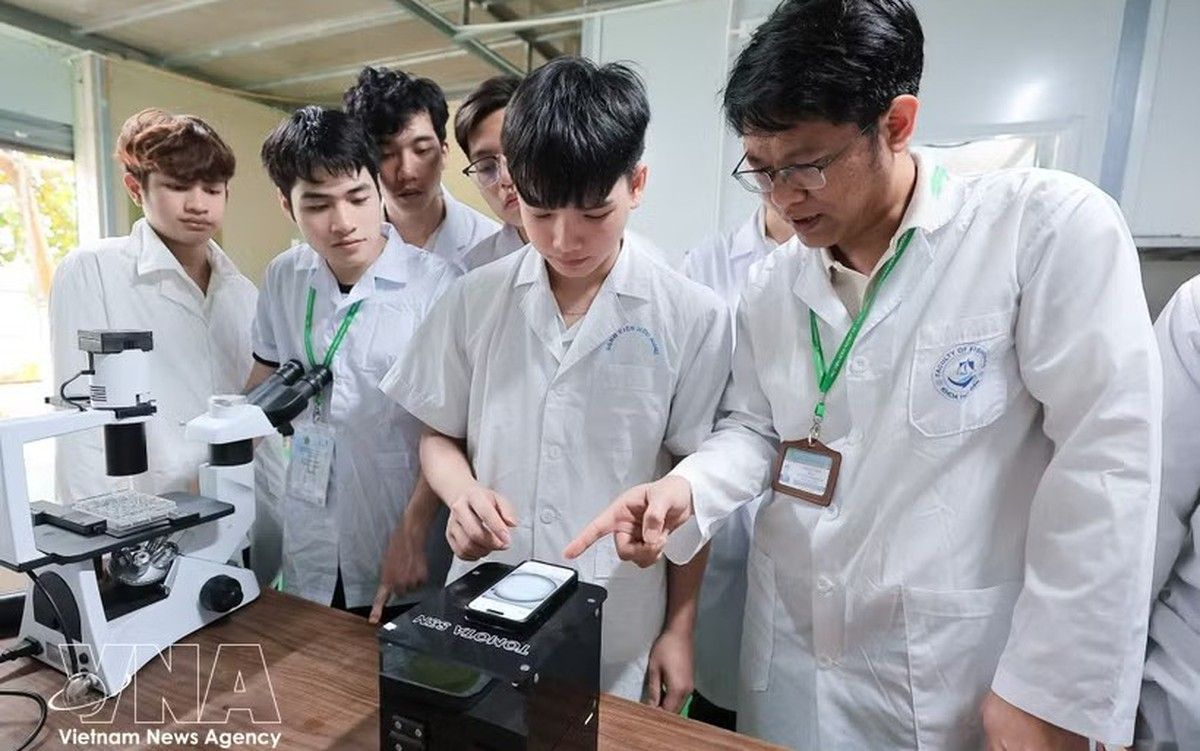 Students and educators in a Vietnamese higher-education setting focused on skilled workforce development.