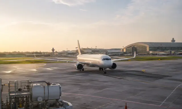 Illustrative view of an aircraft at an unbranded airport apron in Singapore