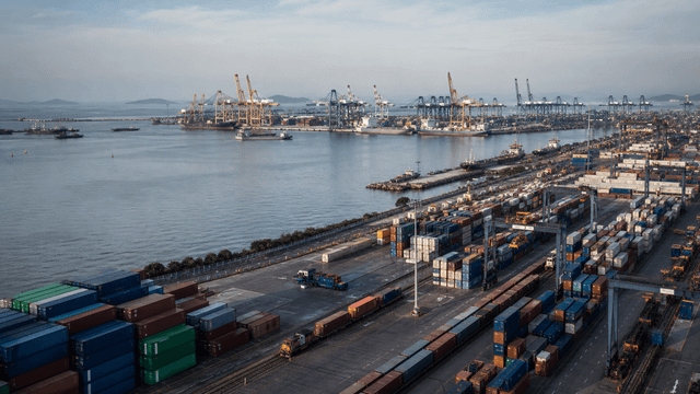 Working container port and freight infrastructure representing regional trade conditions in Southeast Asia.