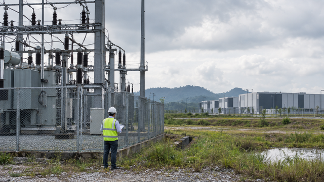 Illustrative scene created for SEA Connect: engineer inspecting power equipment at a generic industrial site.