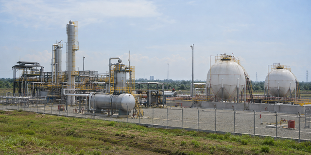 Illustrative view of a generic LPG processing facility with pipework and storage tanks; it does not depict the Cilamaya plant.