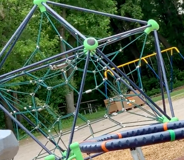 An octagonal jungle gym on a playground