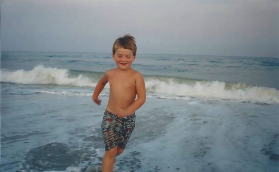 A child playing in the waves.