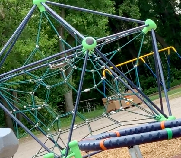 An octagonal jungle gym on a playground