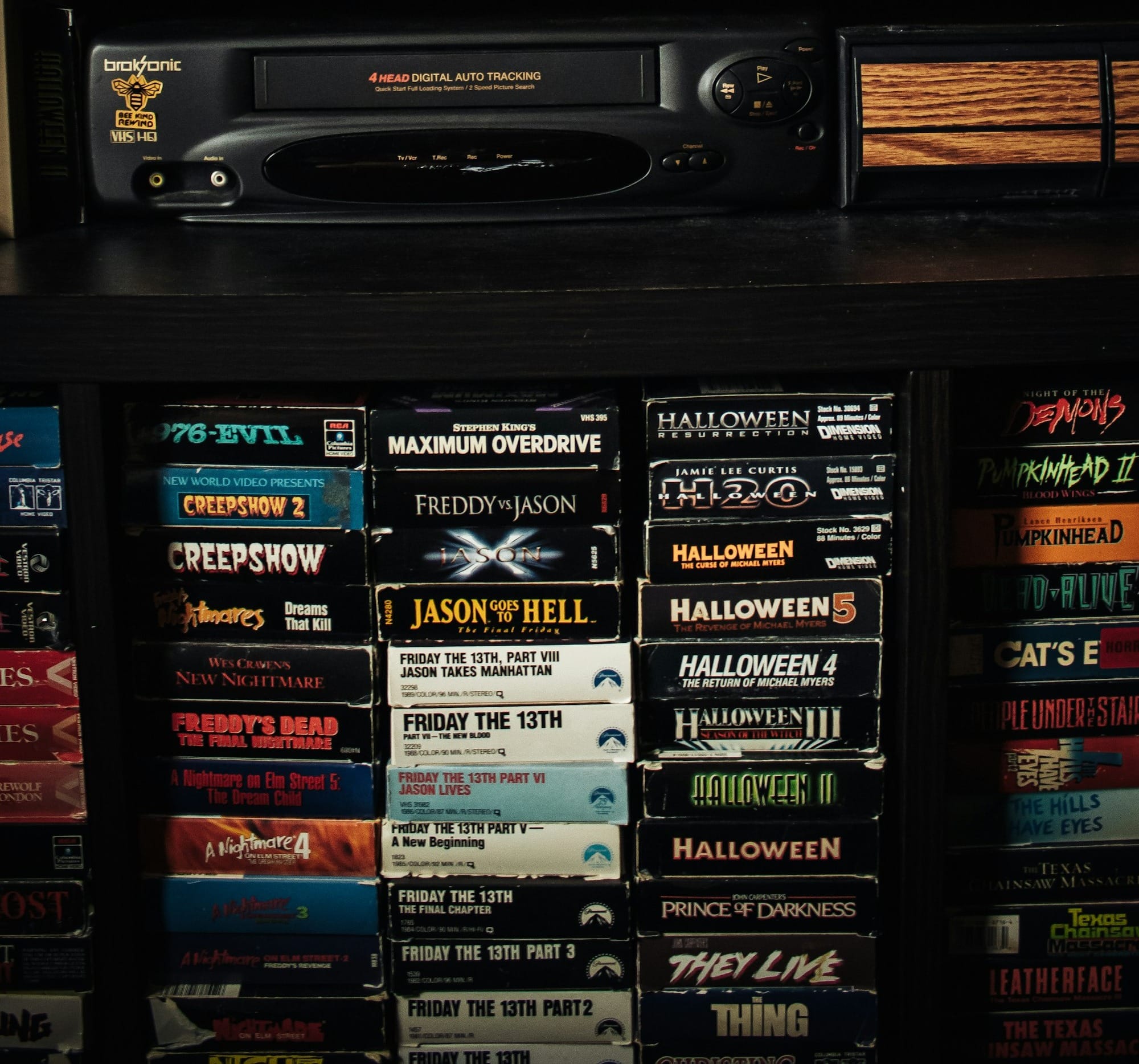 a shelf with a bunch of movies on it