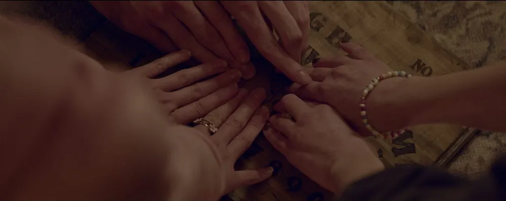 Rebecca Gruss Conjures Humanity in "Thrift Store Ouija Board"