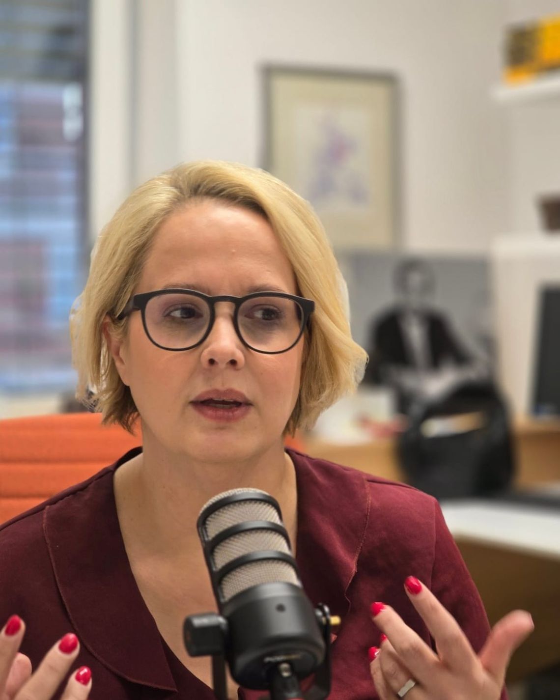 Woman speaking into microphone