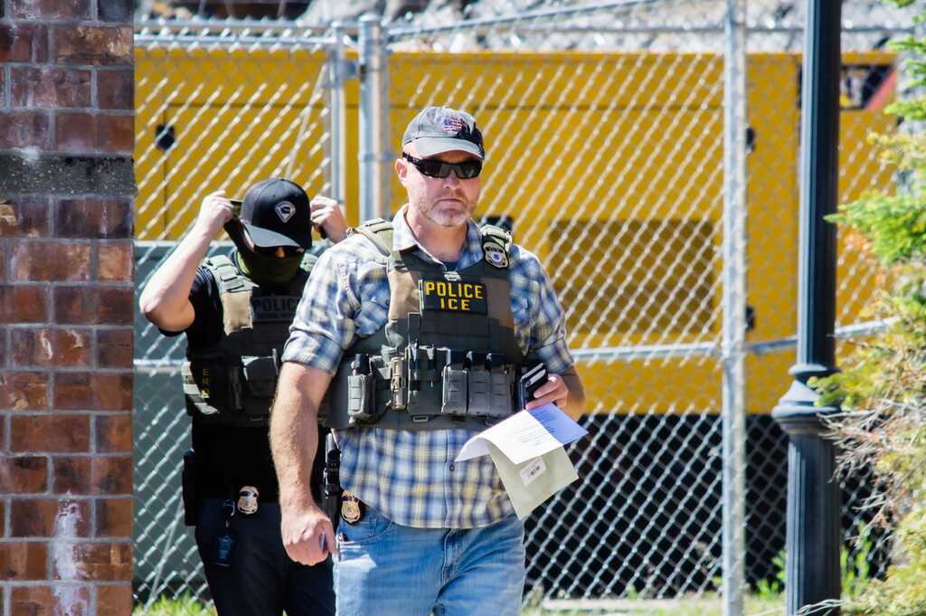 ‘Who is not enforcing this?’: ICE officers continue to mask up despite state ban
