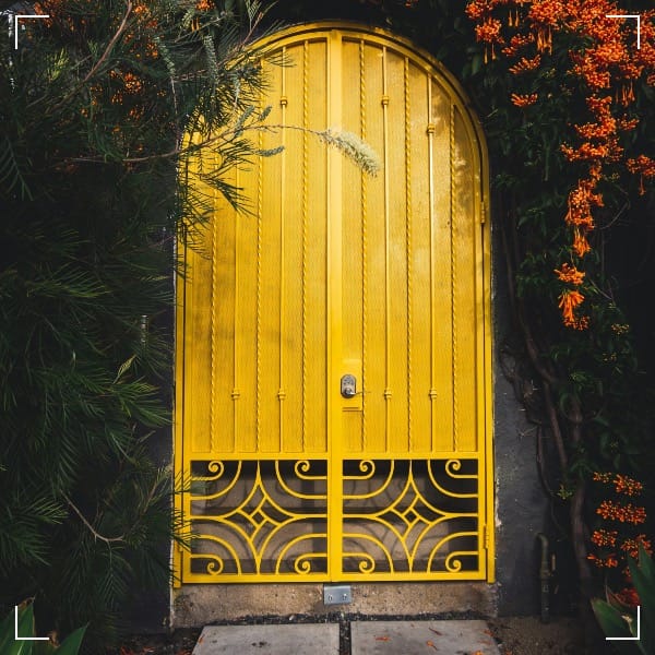 yellow metal door close-up photography