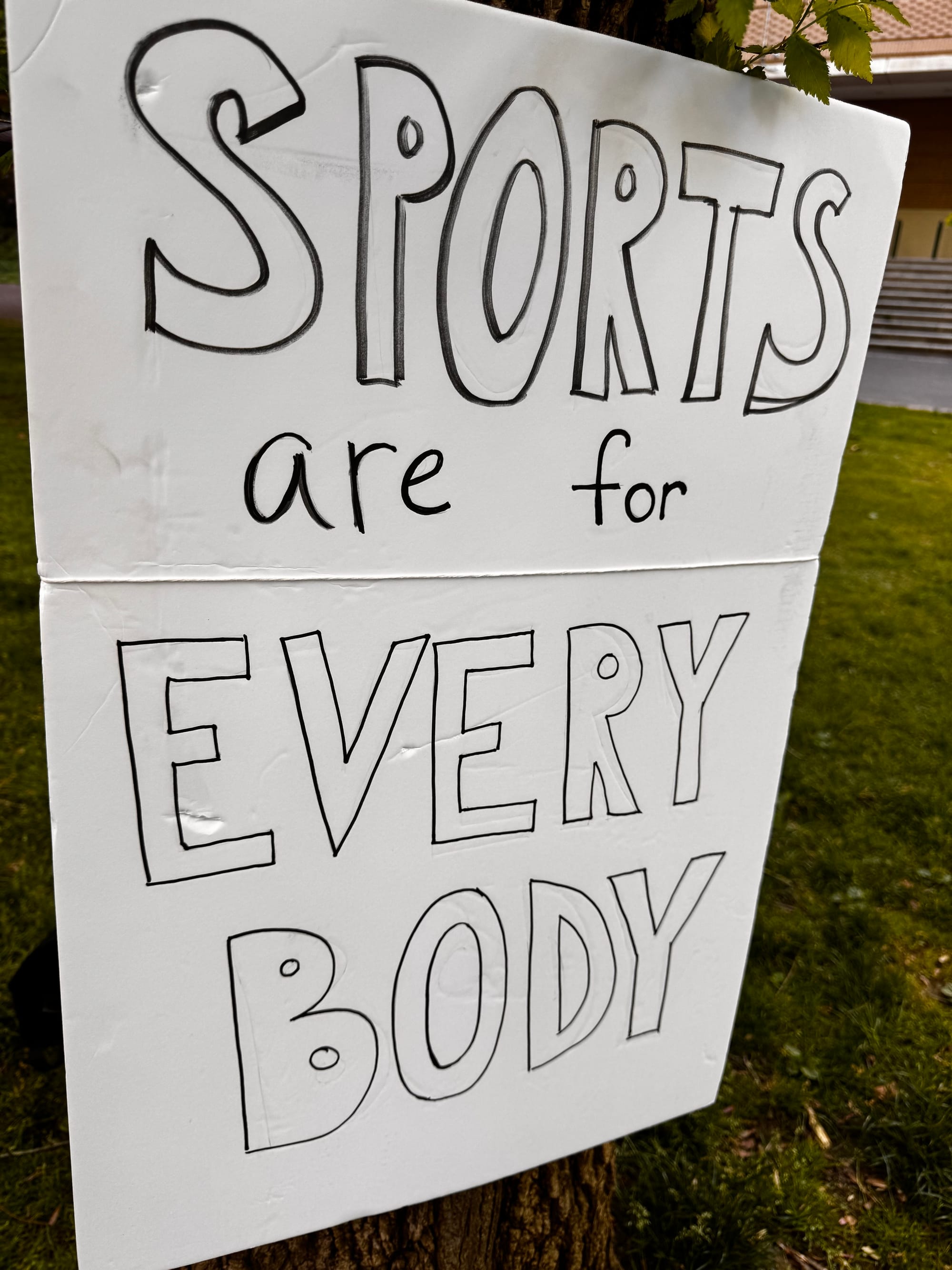 Poster at the sports day block party that says "Sports are for Every Body"