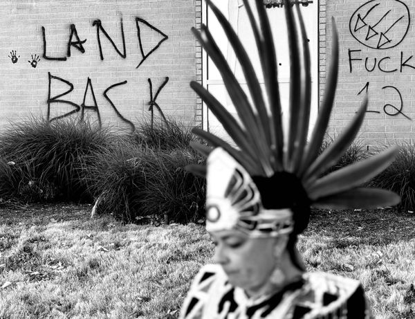 Tracy Molina outside of the ICE facility in Portland during summer of 2025. Photo is in black and white