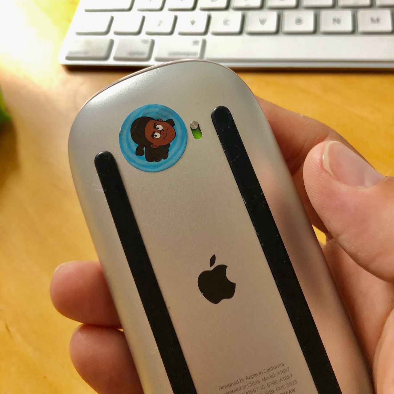 A sticker covering the light on an optical mouse.