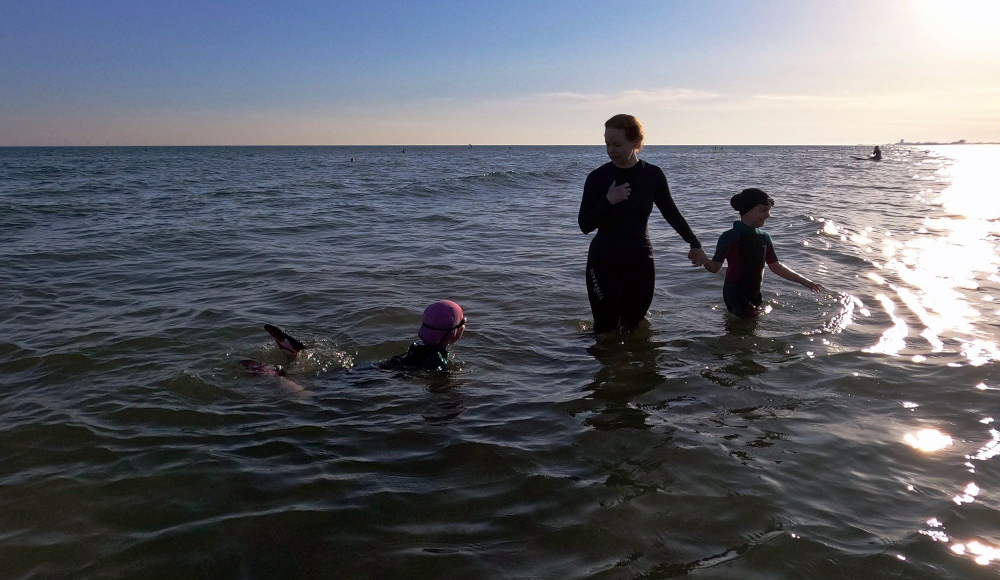 A mother and her daughters in the sea off the Sussex coast.