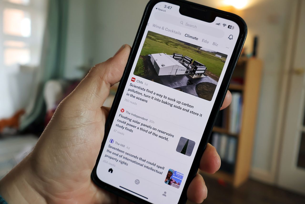 A iPhone running the Artifact news-reading app