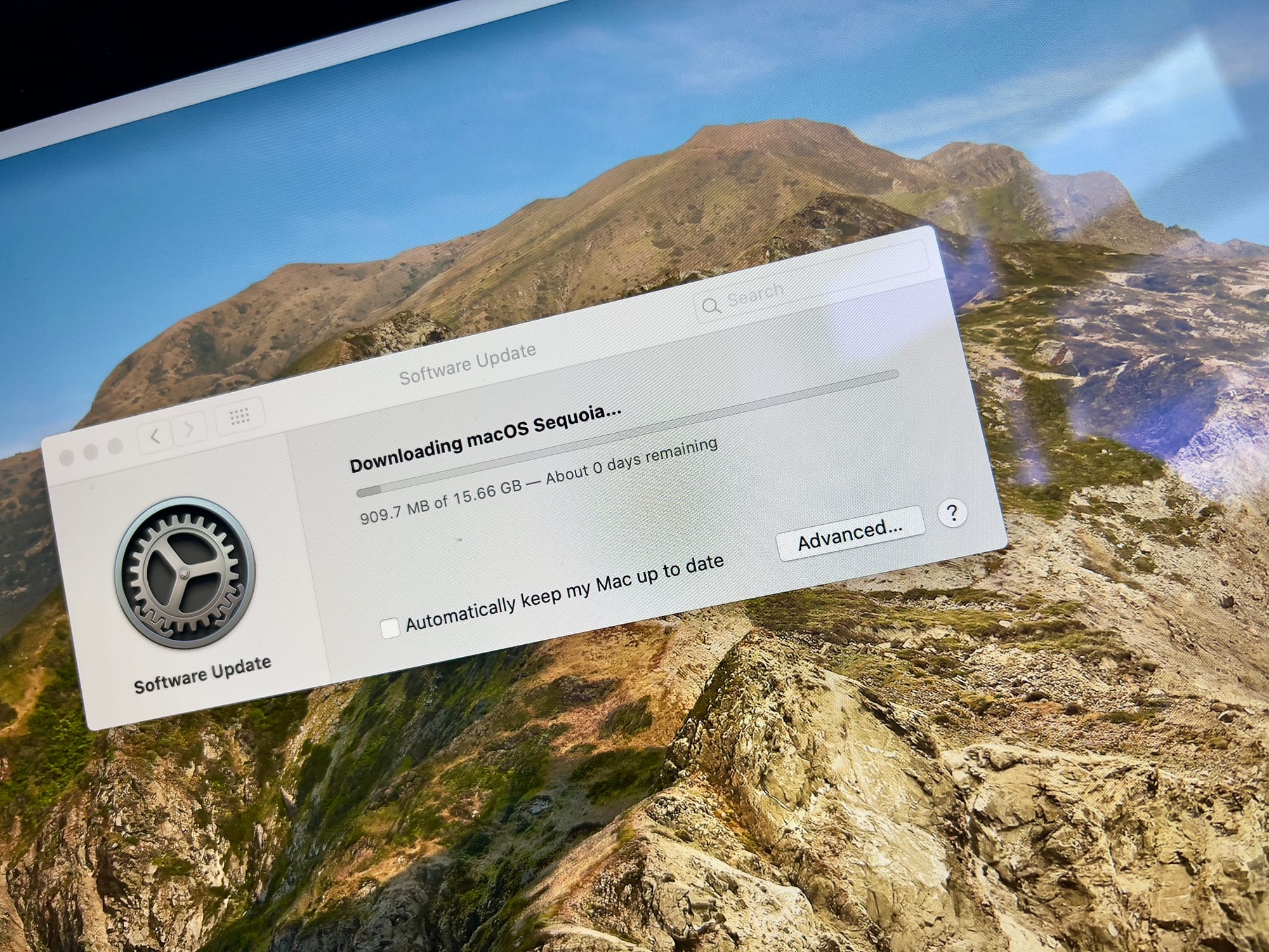 An iMac running macOS Catalina and downloading macOS Sequoia. 