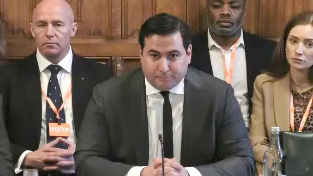 Wifredo Fernandez, senior director for government affairs, X talking to a parliamentary select committee