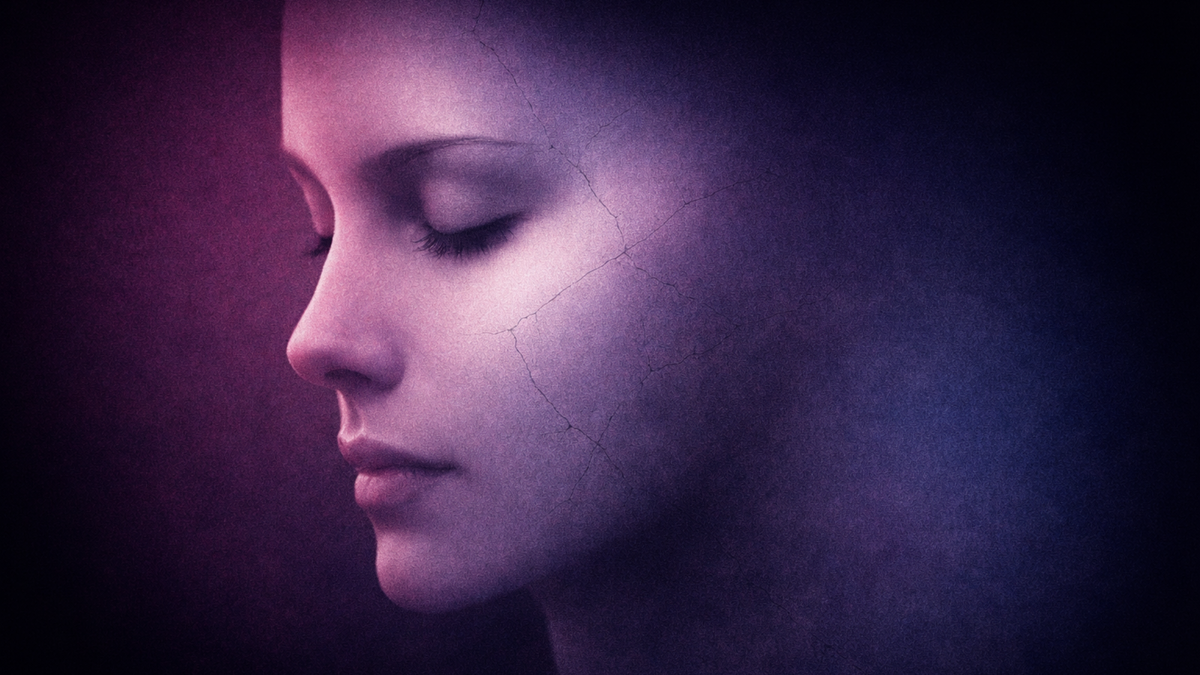 A woman’s face in profile with closed eyes, partially covered by shadow and fine crack-like textures against a dark purple background.