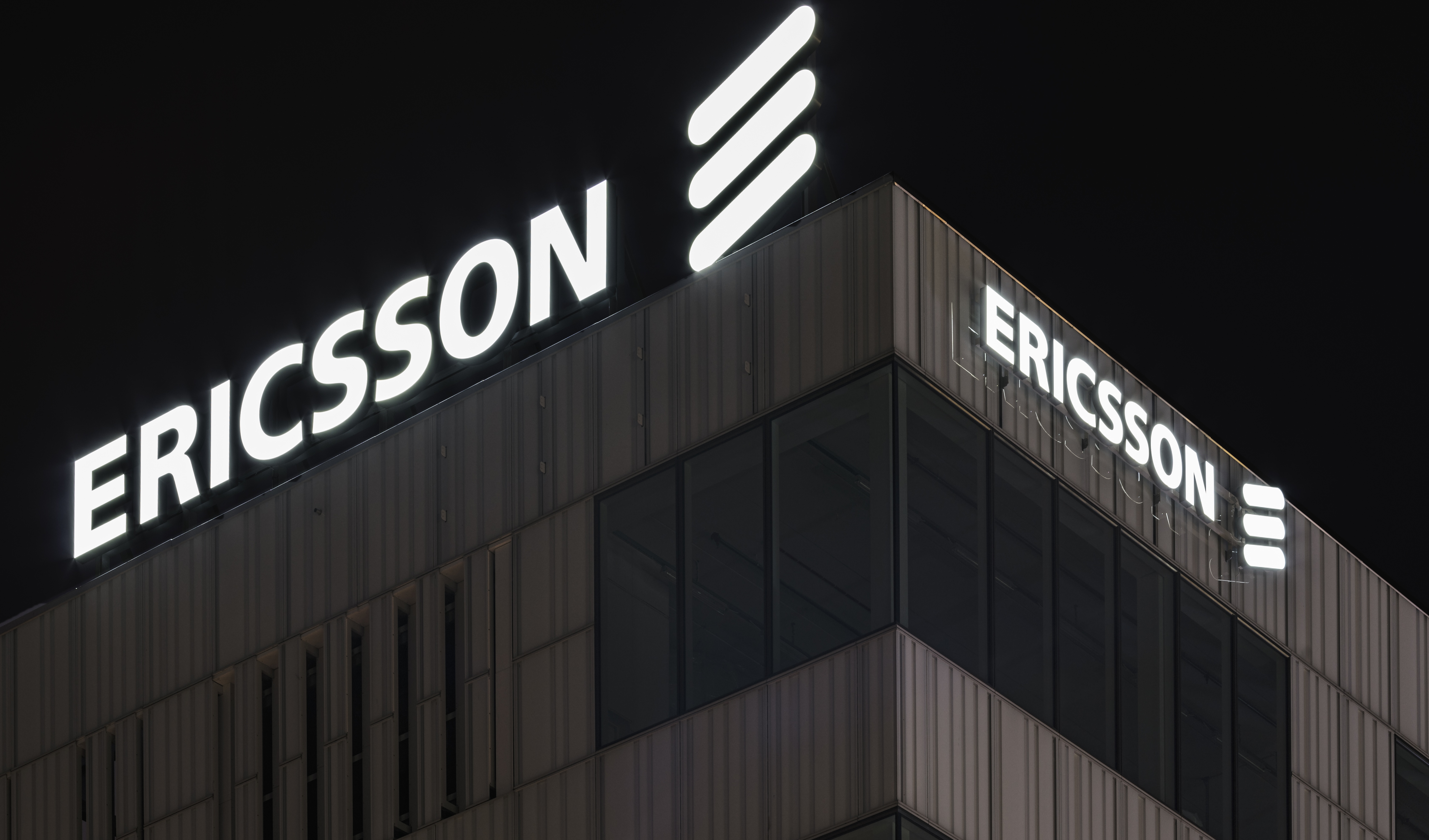 Ericsson headquarters in Kista, Sweeden lit up at night.