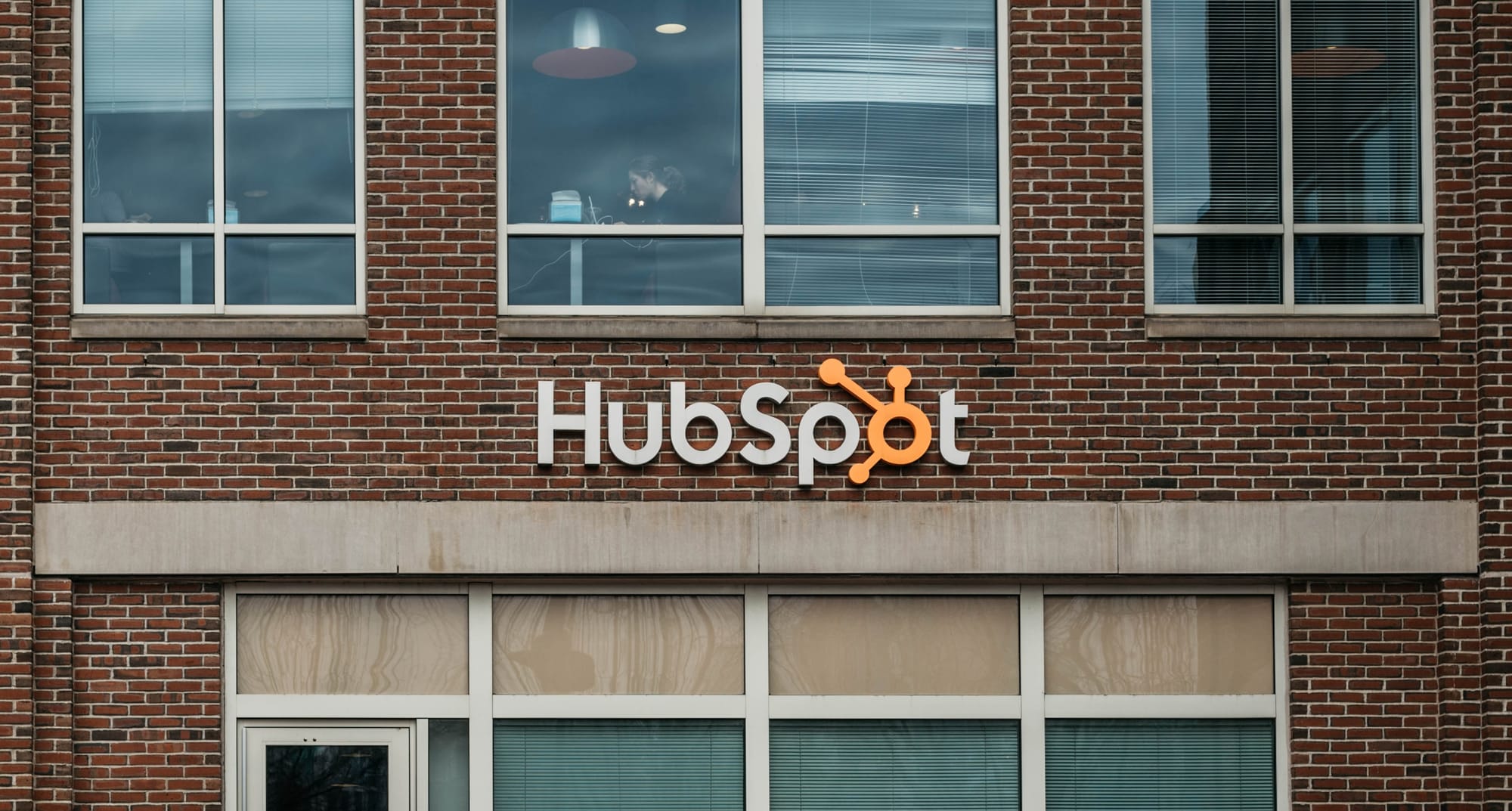 HubSpot logo on brick building in Cambridge, MA.