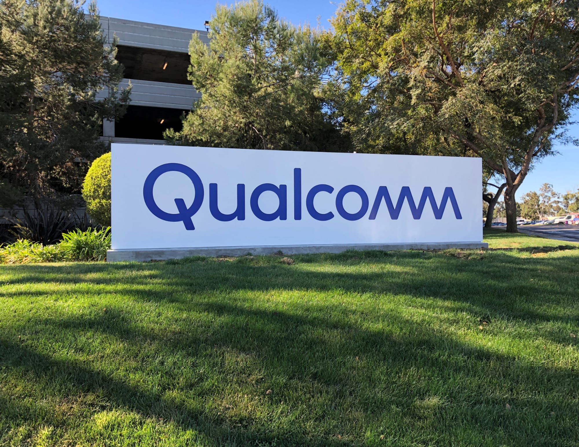 Qualcomm sign on green grass in California.
