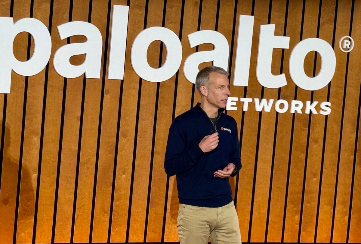 Palo Alto Networks chief product officer Lee Klarich speaking on stage with a paloalto networks logo behind him.