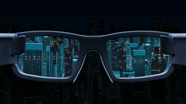 Futuristic cityscape glowing through dark-framed glasses.