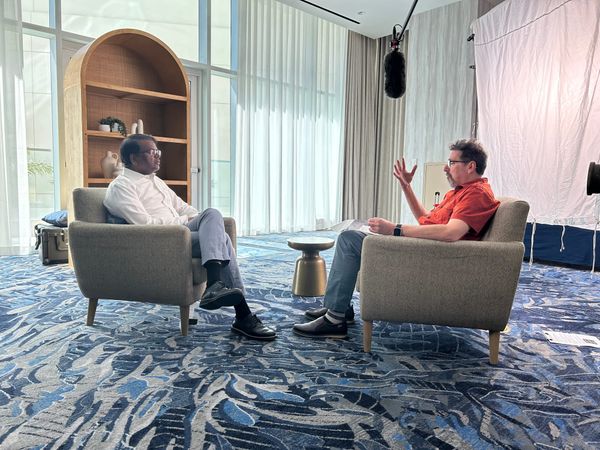 FastForward editor Ron Miller interviews Swamy Kocherlakota in in living room style set.