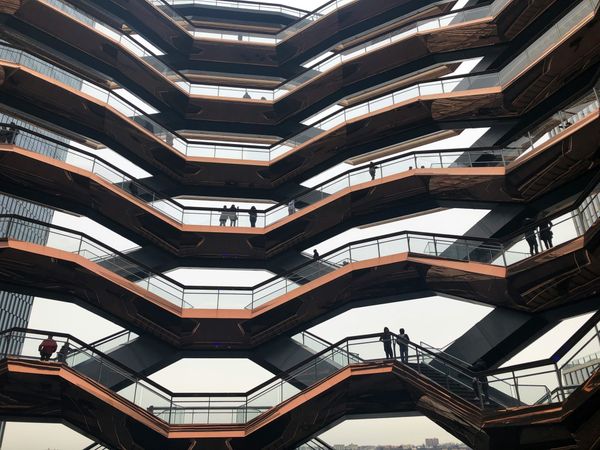 People stand on the interconnected staircases in New York City's Hudson Yards.
