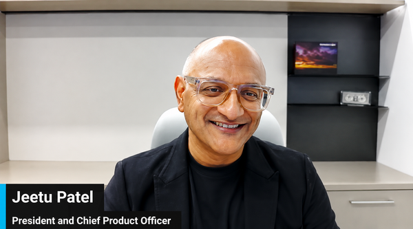 Jeetu Patel, Cisco chief product officer, sitting in a white chair in office.