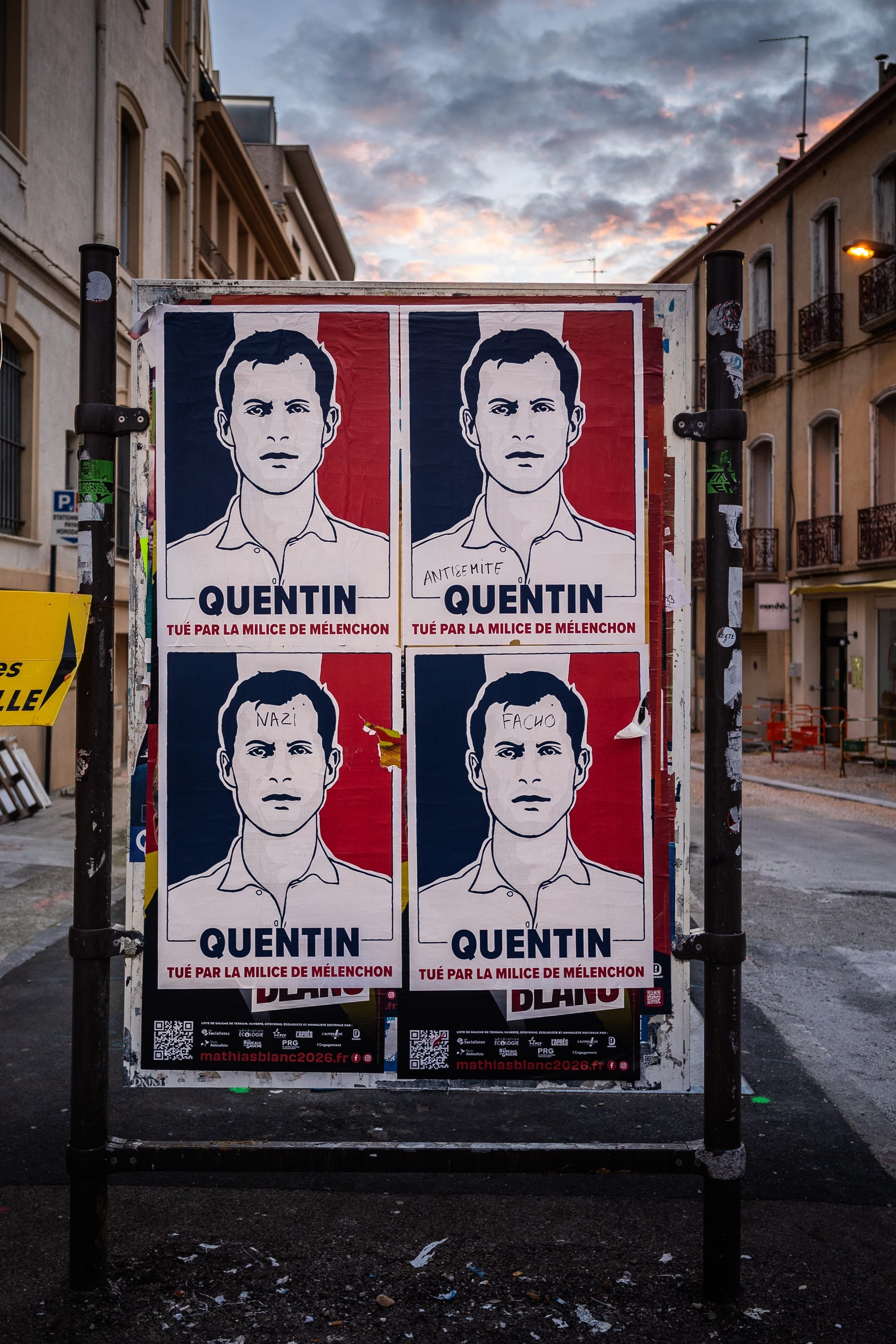 A tricolour poster of Quentin Deranque saying "Quentin killed by Melenchon militia" in French