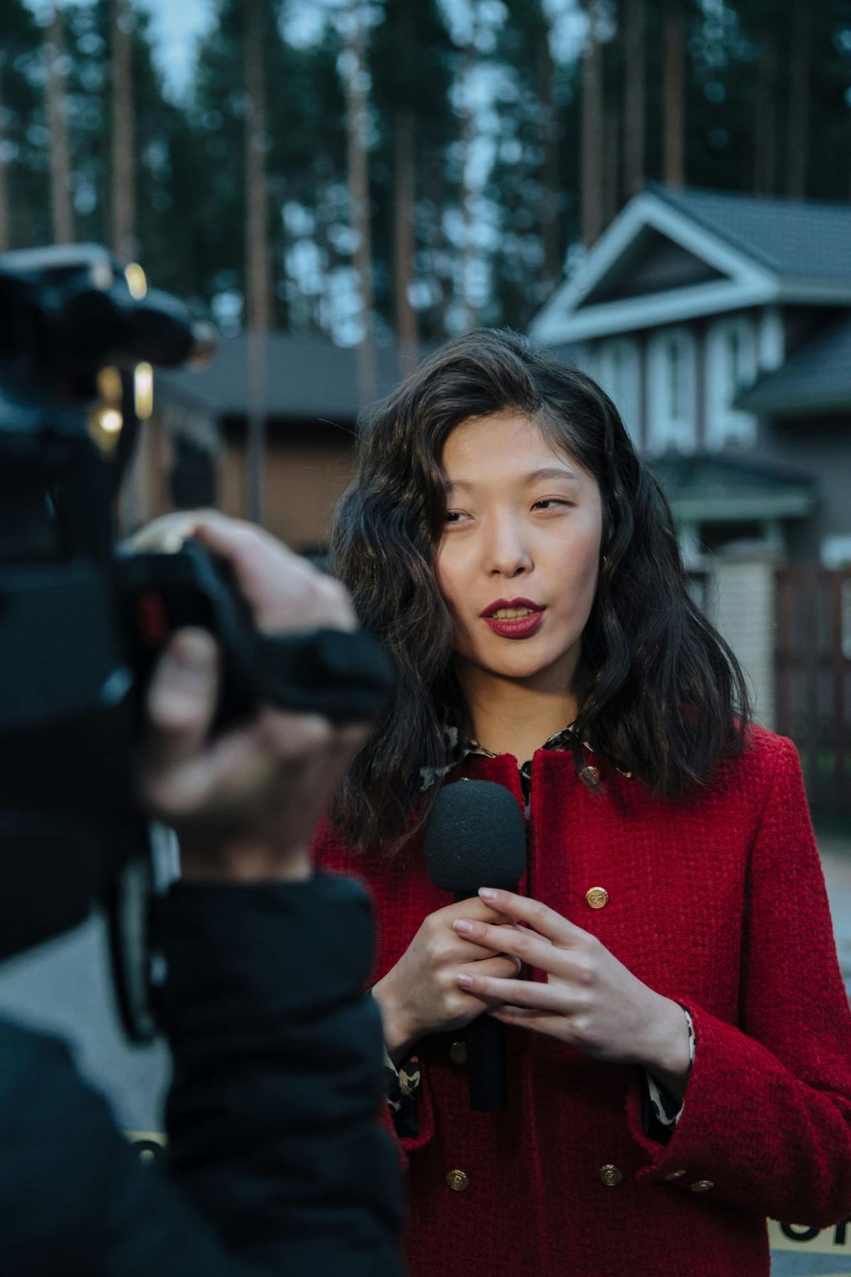 A reporter holding a microphone during an interview