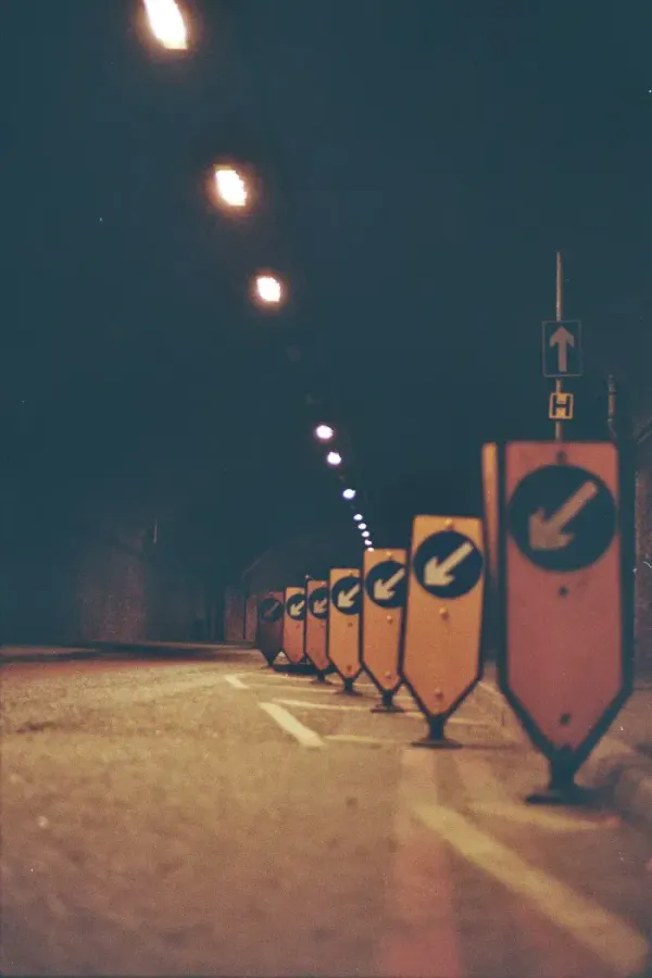 Row of arrow signs in a tunnel, pointing toward manual change detection in Angular