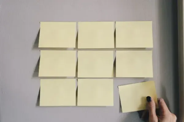 Grid of blank sticky notes with one being placed: exhaustively covering every switch case