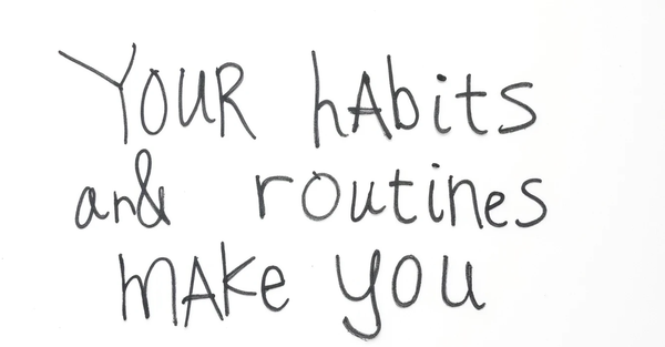 Hand-lettered phrase Your habits and routines make you, framing identity as the sum of daily actions
