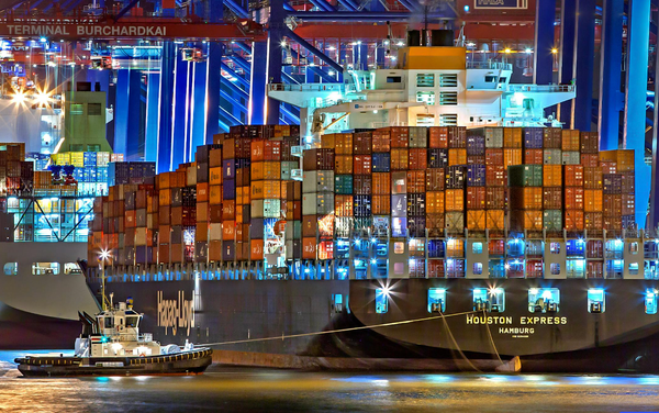 A shipping container vessel full of goods in Hamburg, Germany