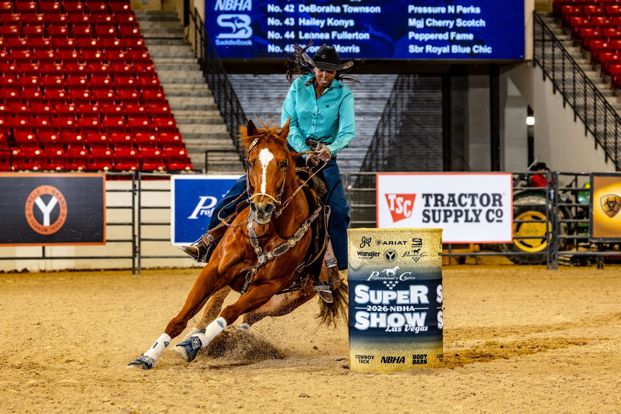 DeBoraha Townson wearing a turquoise shirt, Black cowboy bat and blue jeans rides her Quarter Horse during a barrel race in Las Vegas on May 31, 2026.